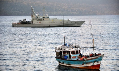 An Australian navy patrol boat escorting an asylum seeker vessel to Christmas Island. 