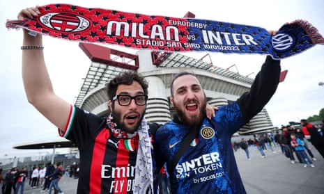 The Milan and Internazionale pose for a photograph with a half and half scarf prior to the UEFA Champions League semi-final first leg match between AC Milan and FC Internazionale.