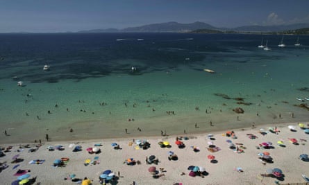 Mediterranean sea and sunbathers in Corsica