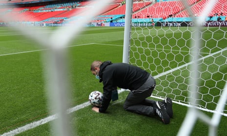 A member of staff conducts a test of the goal line technology system at Wembley.