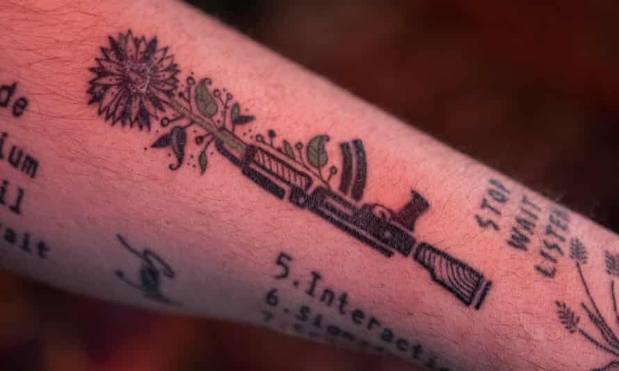 Sunflower tattoo of an AK47