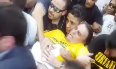 The extreme rightwing presidential candidate Jair Bolsonaro is carried away after being stabbed during a rally on Thursday.