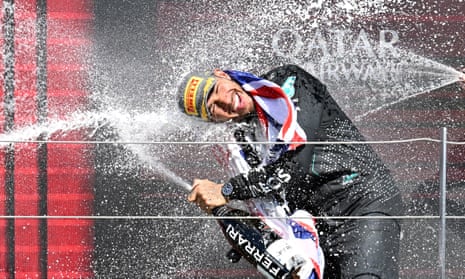Lewis Hamilton of Britain celebrates on the podium.