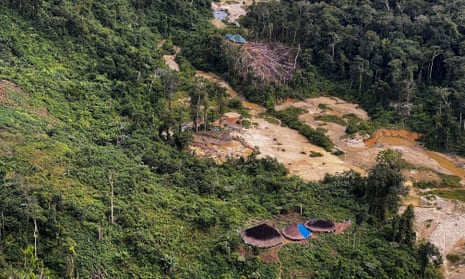 An aerial view of an illegal mining camp surrounding huts of an Indigenous tribe, taken during an operation by the Brazilian Institute of Environment and Renewable Natural Resources (IBAMA) against Amazon deforestation at the Yanomami territory in Roraima State, Brazil, in February.