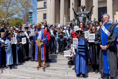 Columbia University professors dressed in commencement regalia and other supporters protest against the university’s recent actions against a pro-Palestinian students’ camp on the university’s campus, on the steps of Low Memorial Library in New York