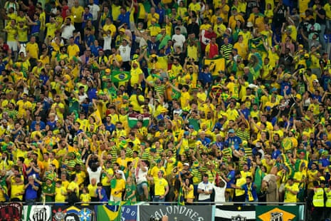 Brazil fans in the stands celebrate their side's first goal, scored by Casemiro.