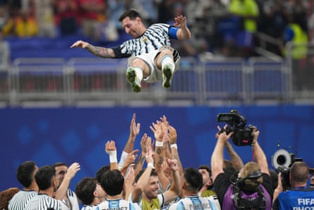 The Argentina players toss Lionel Messi into the air after beating Egypt