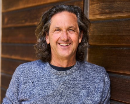A man wearing a grey jumper
