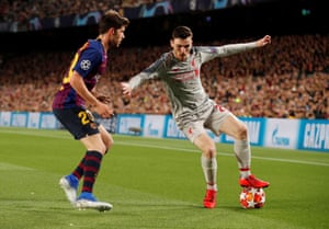 Liverpool’s Andrew Robertson in action with Barcelona’s Sergi Roberto.