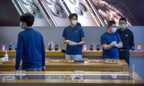 Workers in an Apple store in Beijing.