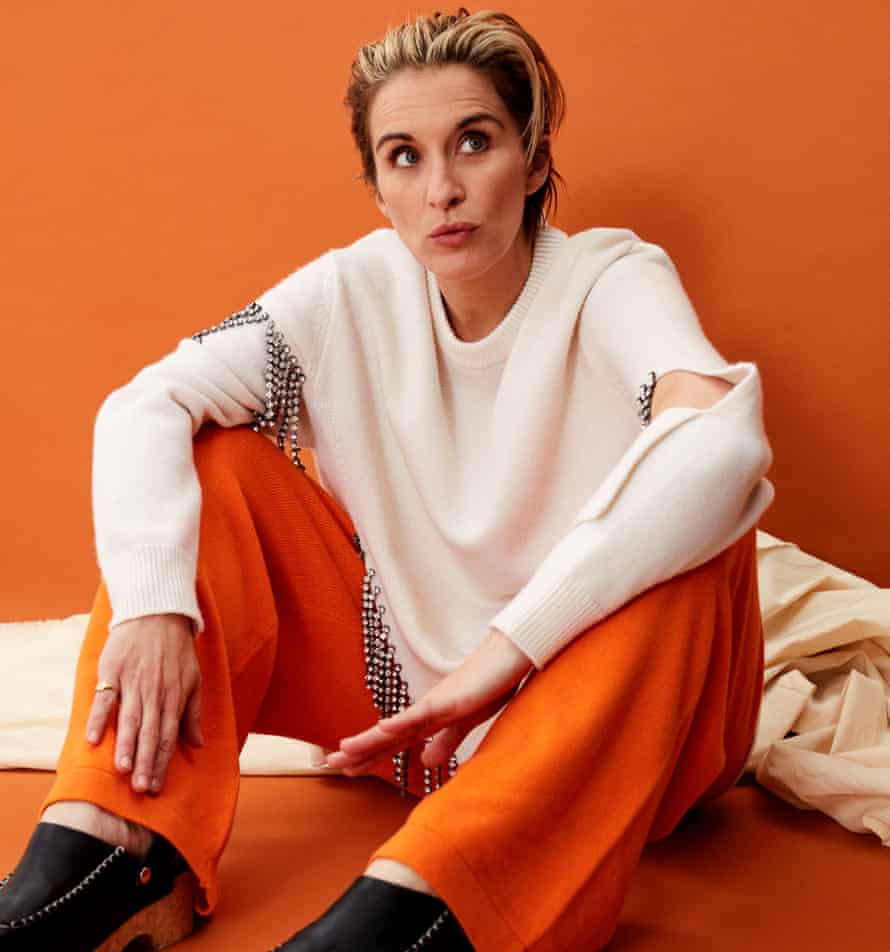 Actor Vicky McClure, in cream top and orange trousers, against orange background, November 2021