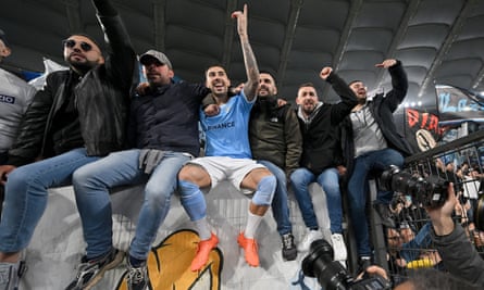 Mattia Zaccagni celebrates with Lazio fans after his win in the Rome derby.