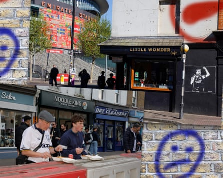 Fans outside the Emirates Stadium and Tottenham Hotspur Stadium
