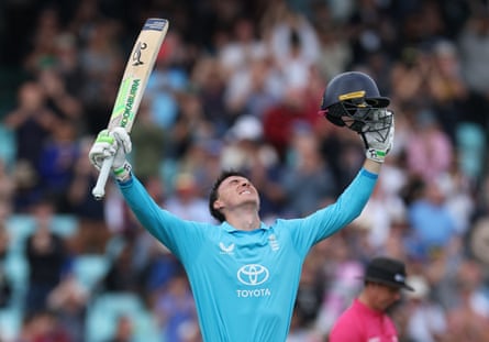 Tom Banton raises his bat in celebration