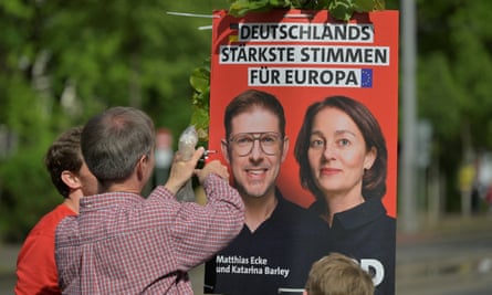 SPD volunteers put up an election poster for Matthias Ecke and Katarina Barley at a rally in Dresden. The poster says ‘Germany’s strongest votes for Europe’