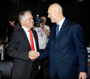Malcolm Turnbull, then the minister for the environment shake hands with Peter Garrett, the shadow environment minister, during the environment debate at the National Press Club in Canberra November, 2007. The Coalition went to the 2007 election with an ETS policy, but backed away from emissions trading under Tony Abbott.