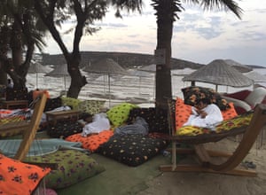 Men asleep on the beachfront following an earthquake in Bitez, a resort town west of Bodrum.