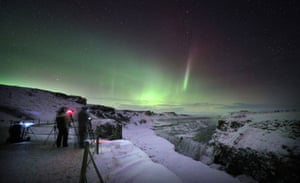 Gulfoss, Iceland Aurora Borealis, or Northern Lights, shine over Gulfoss waterfall