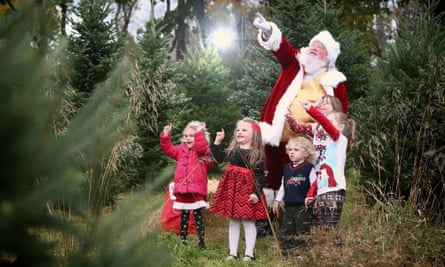 Lance Skapura poses for Christmas photo with children.