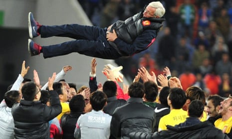 Marcello Lippi is thrown into the air after his Guangzhou Evergrande team won the Chinese Super League in November 2014.