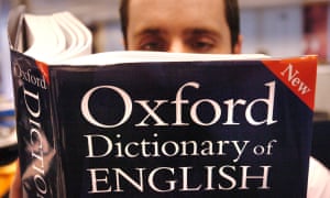 A man reading a copy of the Oxford Dictionary of English. “Post-truth” has been named as Oxford Dictionaries’ word of the year after a spike in its use around the Brexit vote and Donald Trump’s presidential bid. The phrase has long applied to climate denial as well.
