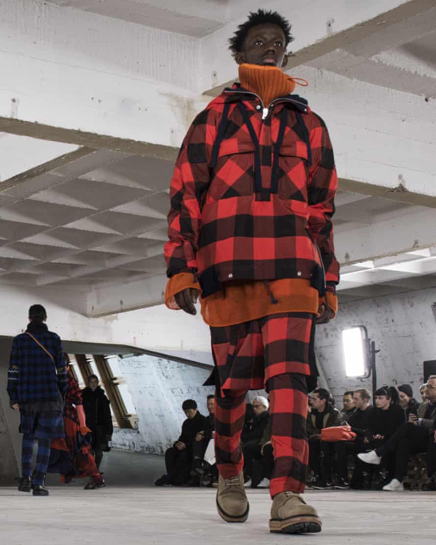 A model walks the runway during the Sacai Menswear show, Paris.
