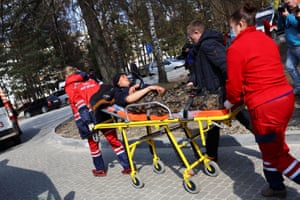 Medics move a wounded soldier, following an attack on the Yavoriv military base, amid Russia’s invasion of Ukraine, at a hospital in Yavoriv, Ukraine, March 13, 2022.