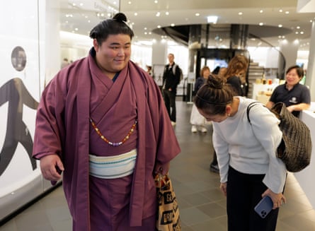 Hakuoho Tetsuya is greeted by members of the public in Japan House on Kensington high street