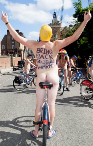 A participant wears a Donald Trump mask as he cycles near Lincoln's Inn Fields