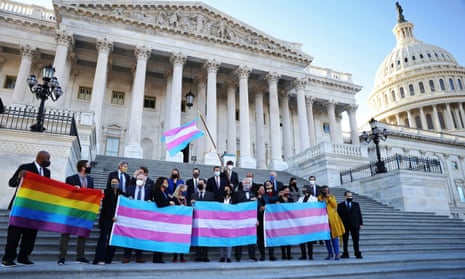 Democratic members of the House take a picture on the steps of the US Capitol while holding LBGTQ+ and transgender pride flags ahead of last month’s vote on the Equality Act.