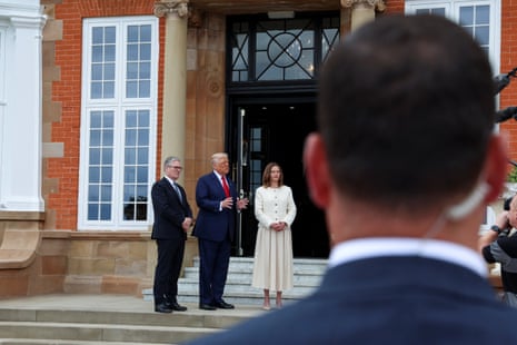 Donald Trump speaking to the media, with Keir Starmer and his wife Victoria alongside him.