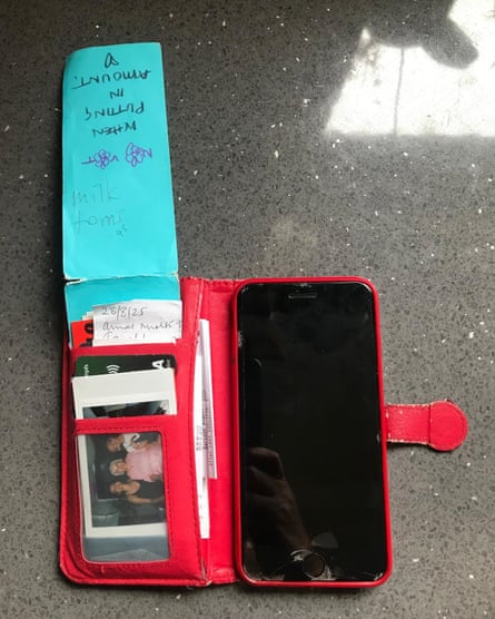 Polaroid of her with her daughter and her son’s girlfriend, cards, pieces of paper and her phone