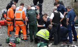London under attack: Conservative MP Tobias Ellwood (centre) helps emergency services. Which other terror atrocity was he affected by (Q31)?