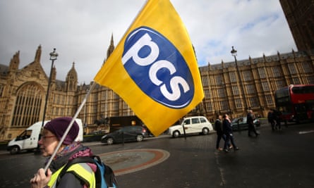 Demonstrators from the Public and Commercial Services Union protest outside the Houses of Parliament in London