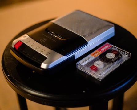 A cassette player and tape on a small round table