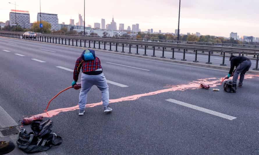 Protesters spill red paint on the Łazieńkowski Bridge