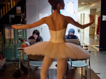 Dancer warming up before a performance of Etudes, in a technical area backstage