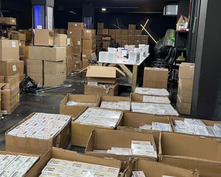 Boxes of weight-loss jab pens on a factory floor.