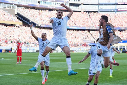 Aymen Hussein jumps for joyousness aft scoring Iraq’s equaliser