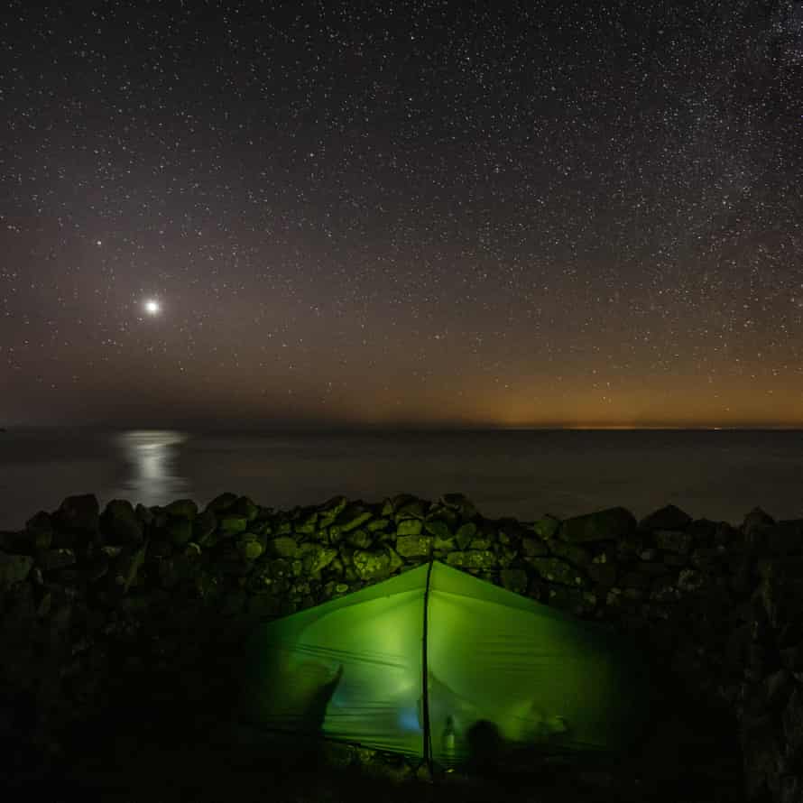 Venus above camp at Penbwchdy, Pembrokeshire. The Glow across the sea is Ireland.