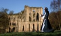 a monk re-enacts a ritual outside the semi-derelict Rievaulx Abbey in the North York Moors national park