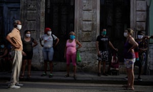 People queue to buy food amid concerns about the spread of the coronavirus outbreak, in downtown Havana last month.