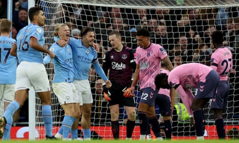 Manchester City’s Erling Haaland celebrates scoring their first goal with Jack Grealish.