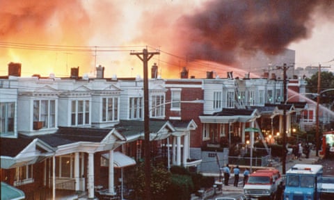 Row houses in Philadelphia burn after officials dropped a bomb on the MOVE house in this May 1985 photo from files.