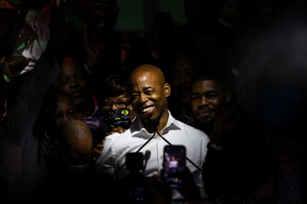 A man smiles in a crowd of people