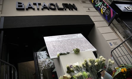 A commemorative plaque and flowers outside the Bataclan concert hall.