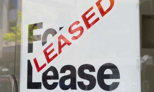 For lease and leased sign on display outside a building.