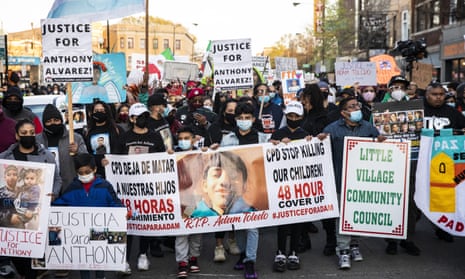 People march on 16 April 2021 near Mayor Lori Lightfoot's home to protest the fatal shooting by Chicago police of 13-year-old Adam Toledo.