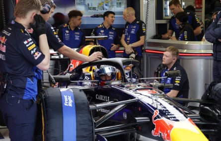 Mechanics work on Max Verstappen’s Red Bull in Bahrain