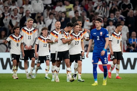 Florian Wirtz celebrates with teammates after scoring Germany’s second goal.